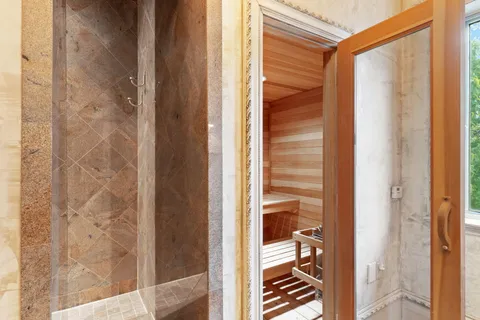 a bathroom with a toilet a sink and a mirror