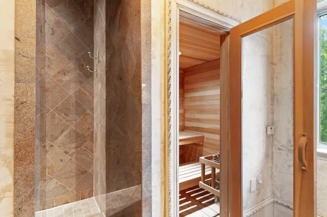 a bathroom with a toilet a sink and a mirror