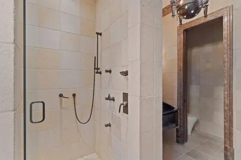 a living room with furniture a large window and a fireplace