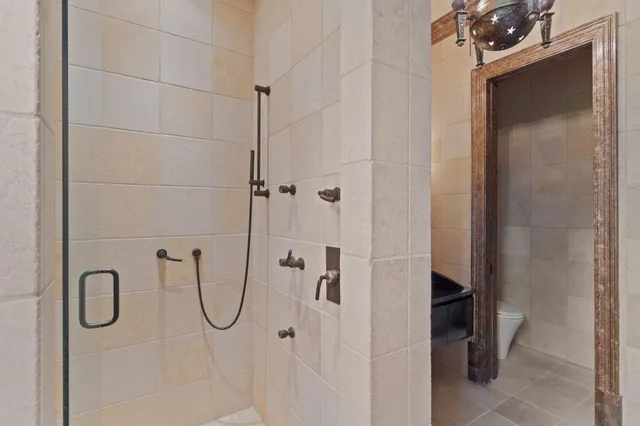 a living room with furniture a large window and a fireplace