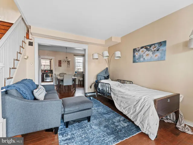 a bedroom with a bed and couch