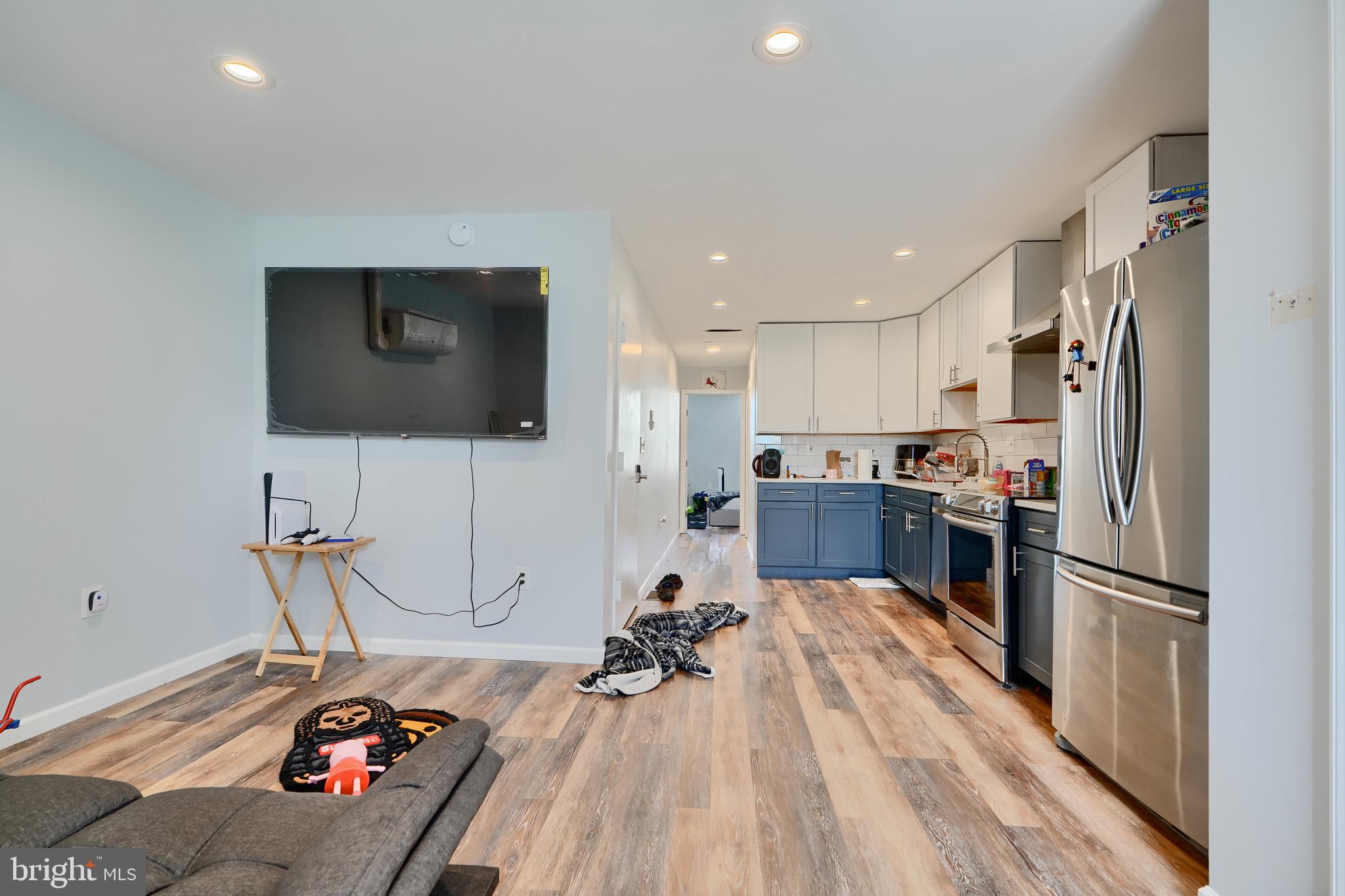 1729 Guilford Avenue, Unit 2 Baltimore, MD 21202 - Photo 7 of 15 a view of a living room or kitchen and a flat screen tv