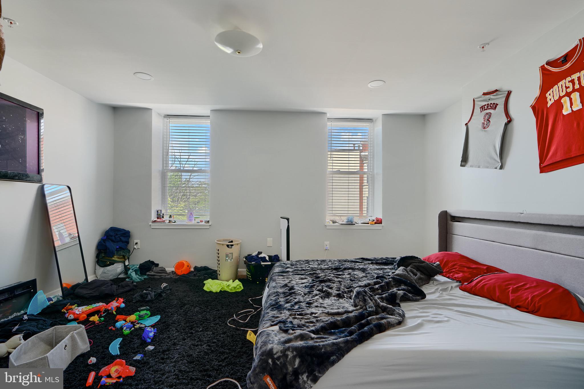 1729 Guilford Avenue, Unit 2 Baltimore, MD 21202 - Photo 10 of 15 a bedroom with bed and a window