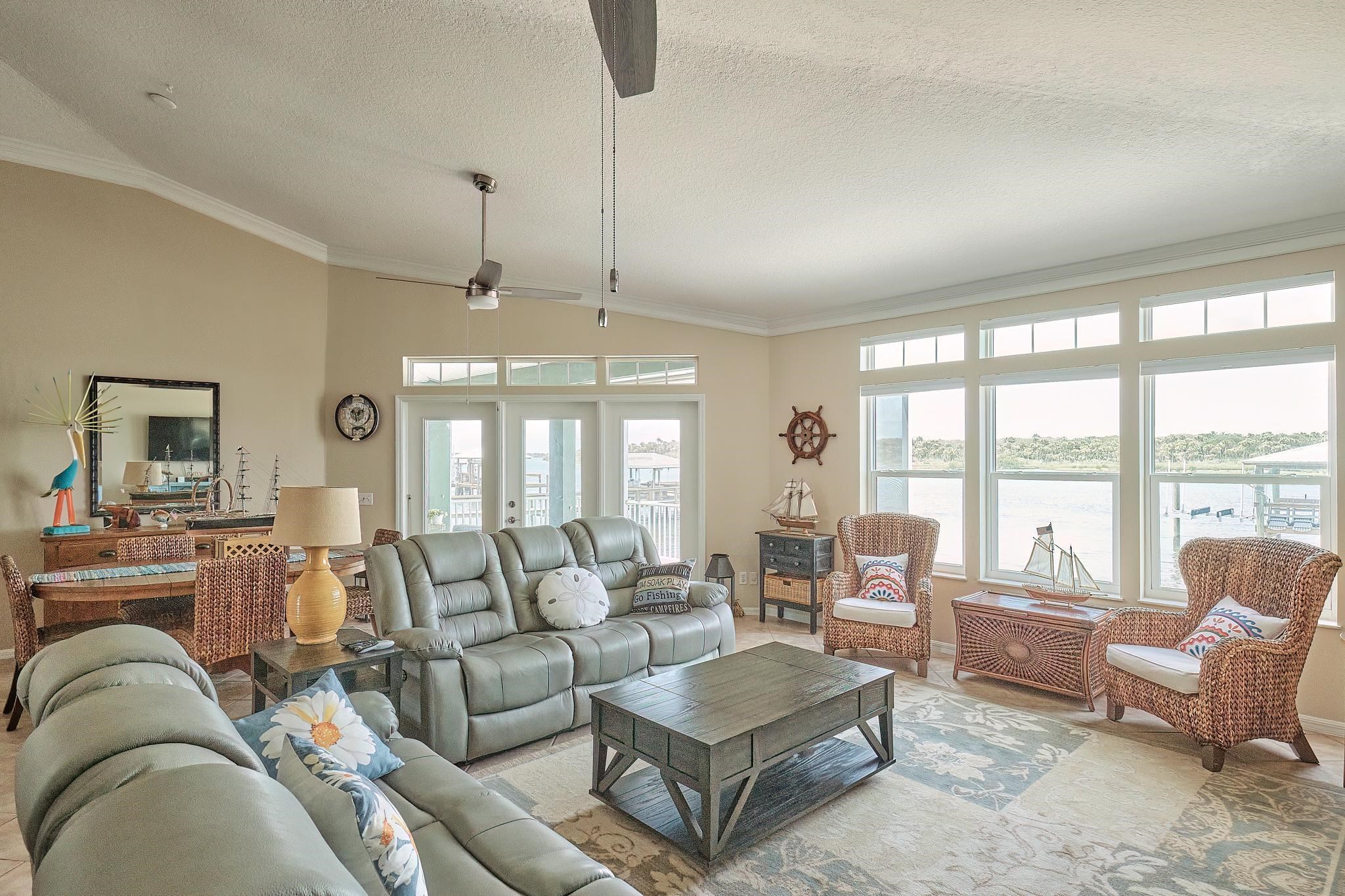 9257 July Lane St. Augustine, FL 32080 - Photo 12 of 48 a living room with furniture and a large window
