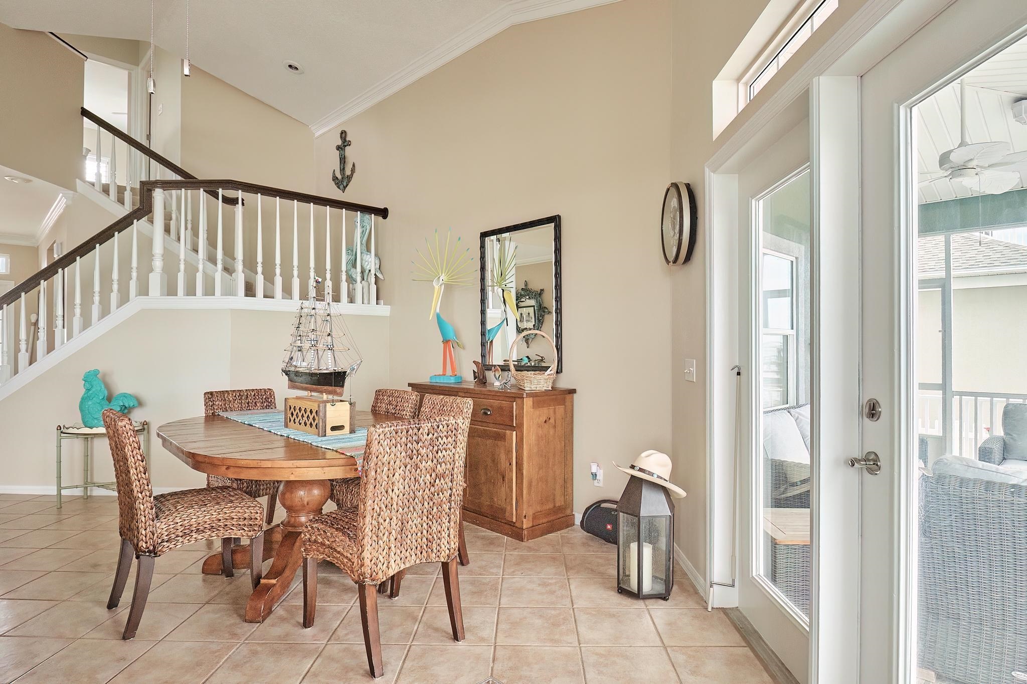 9257 July Lane St. Augustine, FL 32080 - Photo 14 of 48 a view of a dining room with furniture window and wooden floor