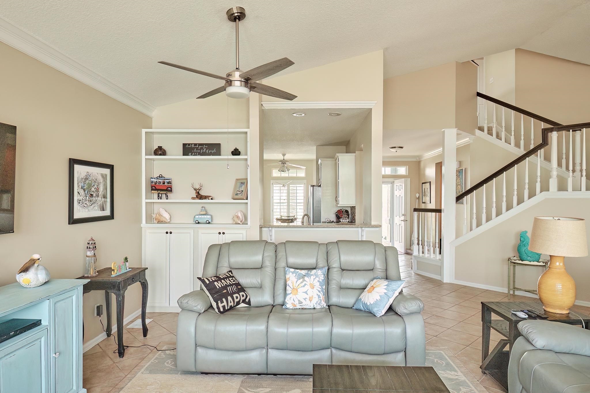 9257 July Lane St. Augustine, FL 32080 - Photo 15 of 48 a living room with furniture and a chandelier