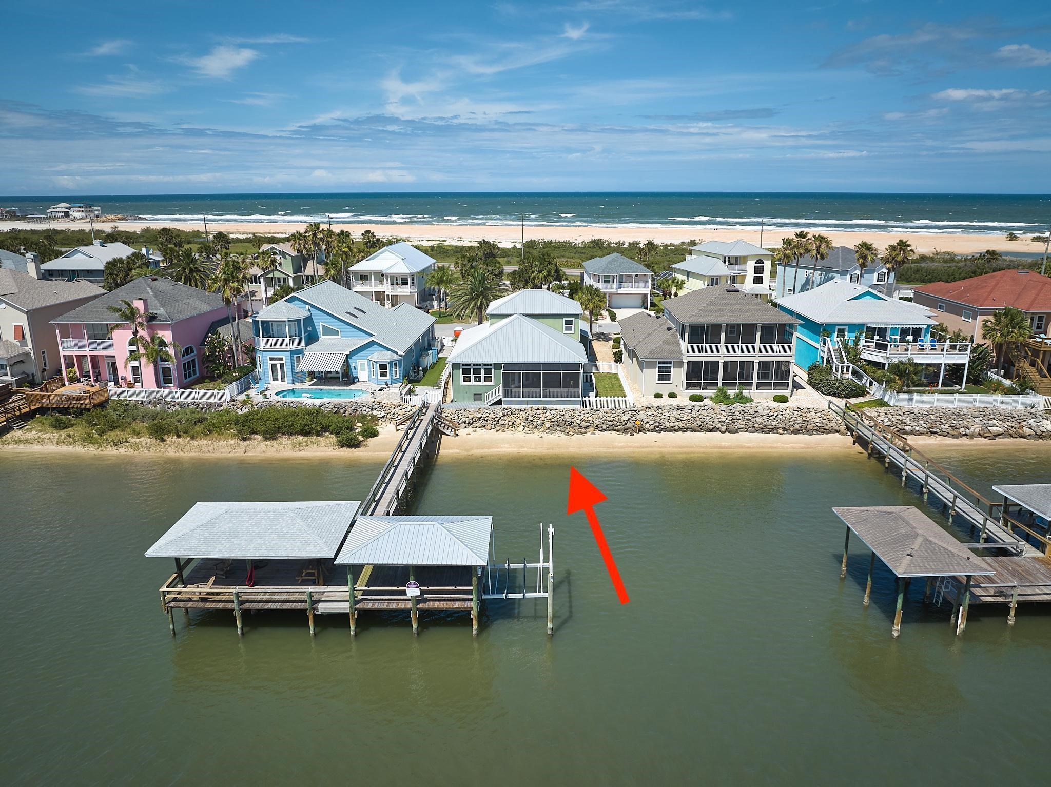 9257 July Lane St. Augustine, FL 32080 - Photo 2 of 48 a roof deck with table and chairs a barbeque