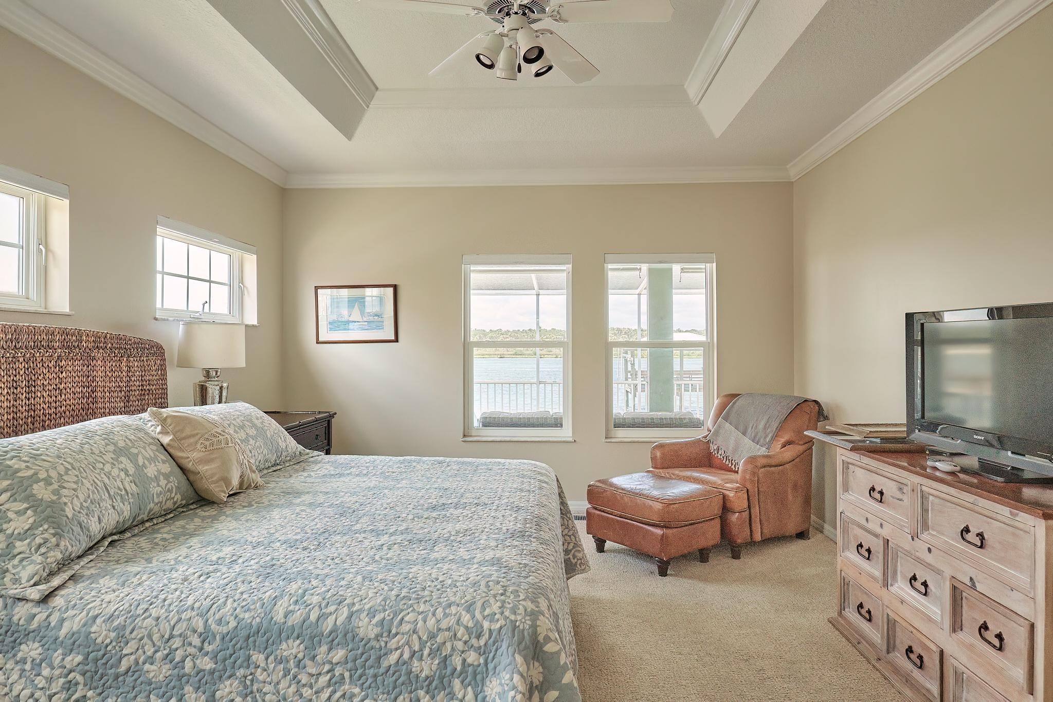 9257 July Lane St. Augustine, FL 32080 - Photo 28 of 48 a bedroom with a bed and a couch