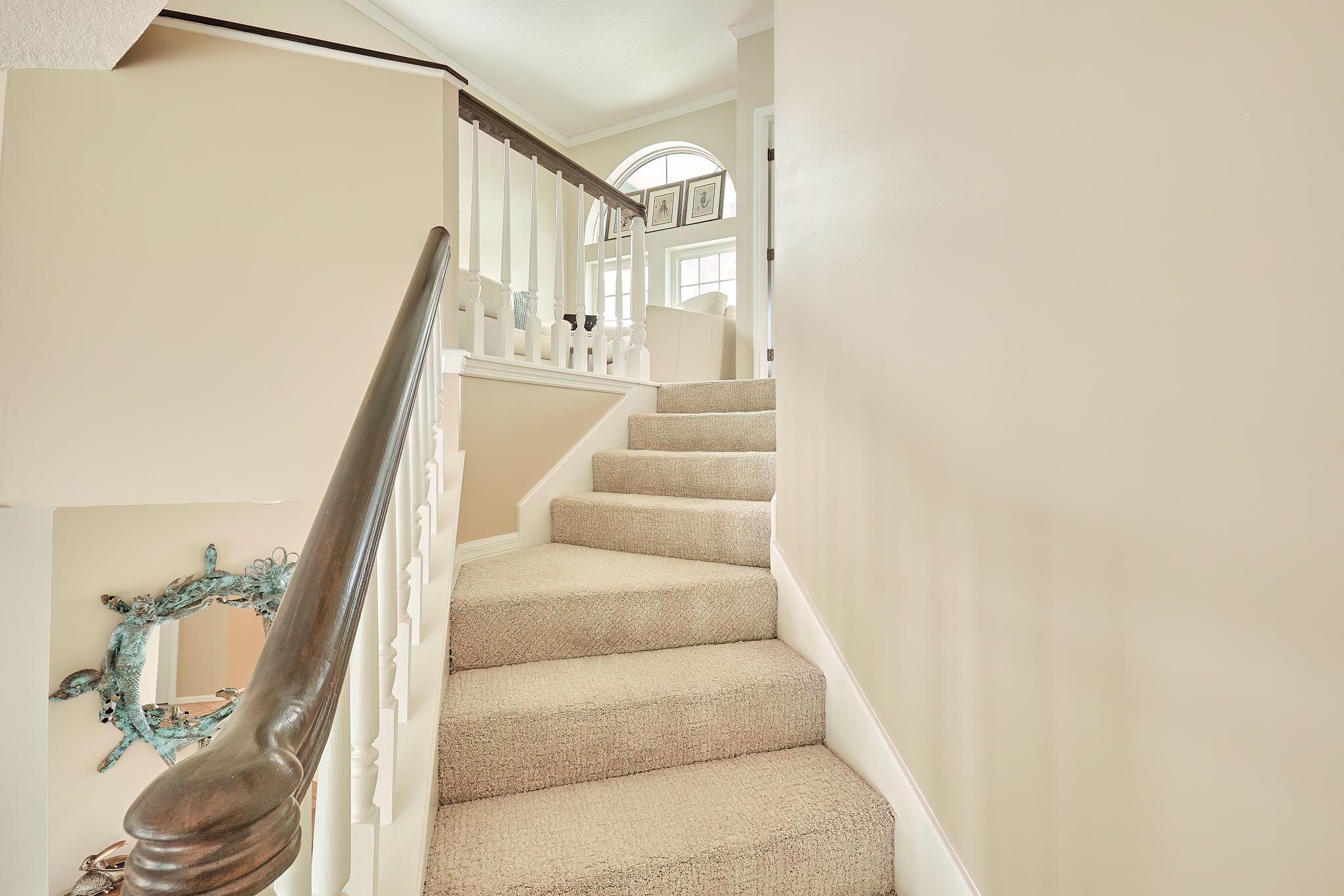 9257 July Lane St. Augustine, FL 32080 - Photo 33 of 48 a view of staircase with white walls and a window