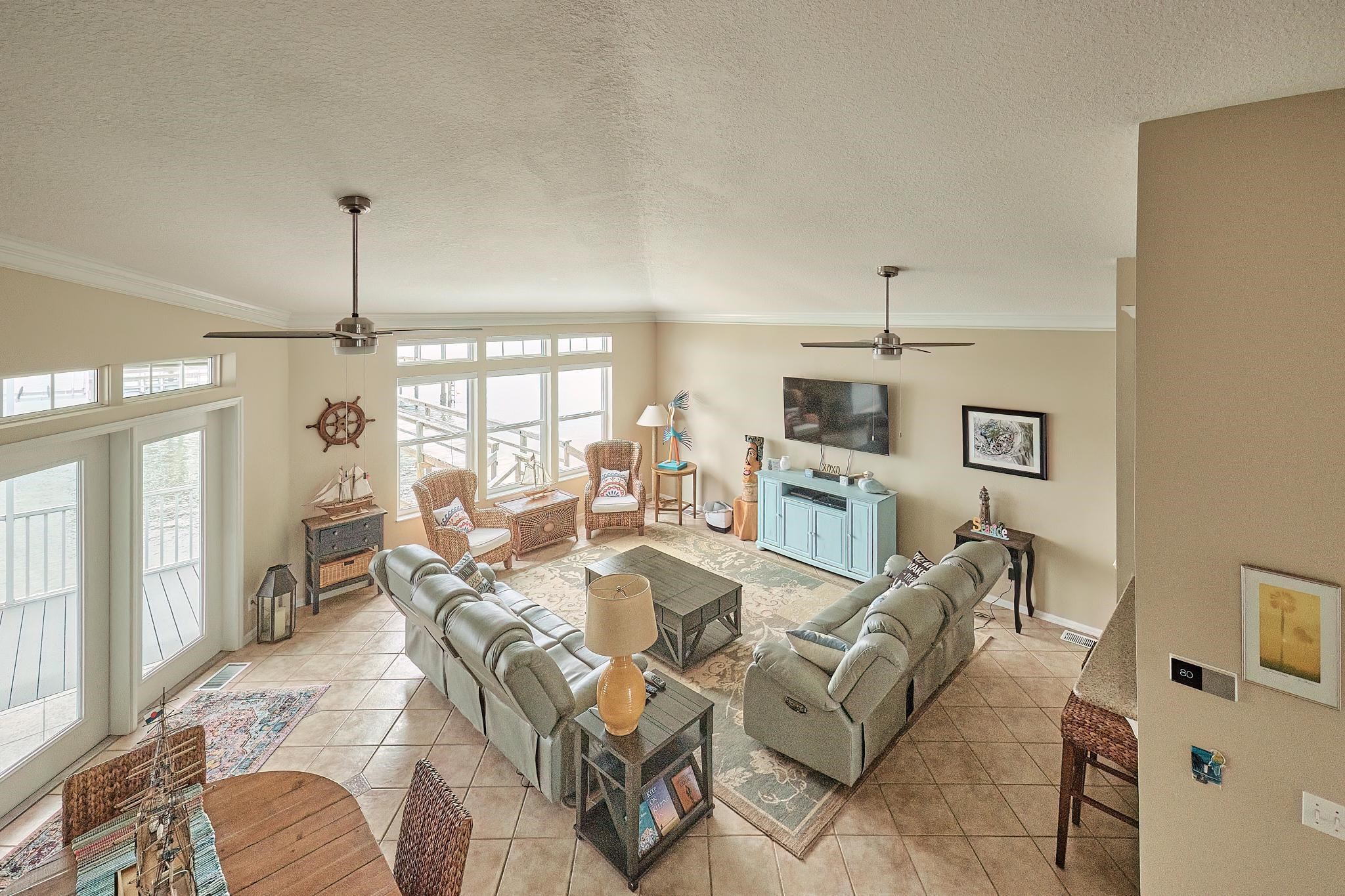 9257 July Lane St. Augustine, FL 32080 - Photo 34 of 48 a living room with fireplace furniture and a flat screen tv