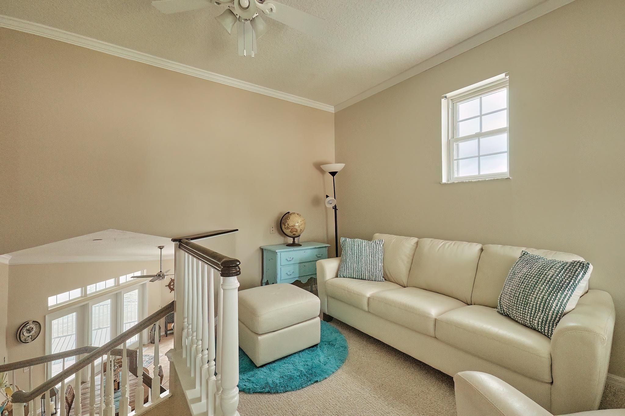 9257 July Lane St. Augustine, FL 32080 - Photo 35 of 48 a living room with furniture and a couch