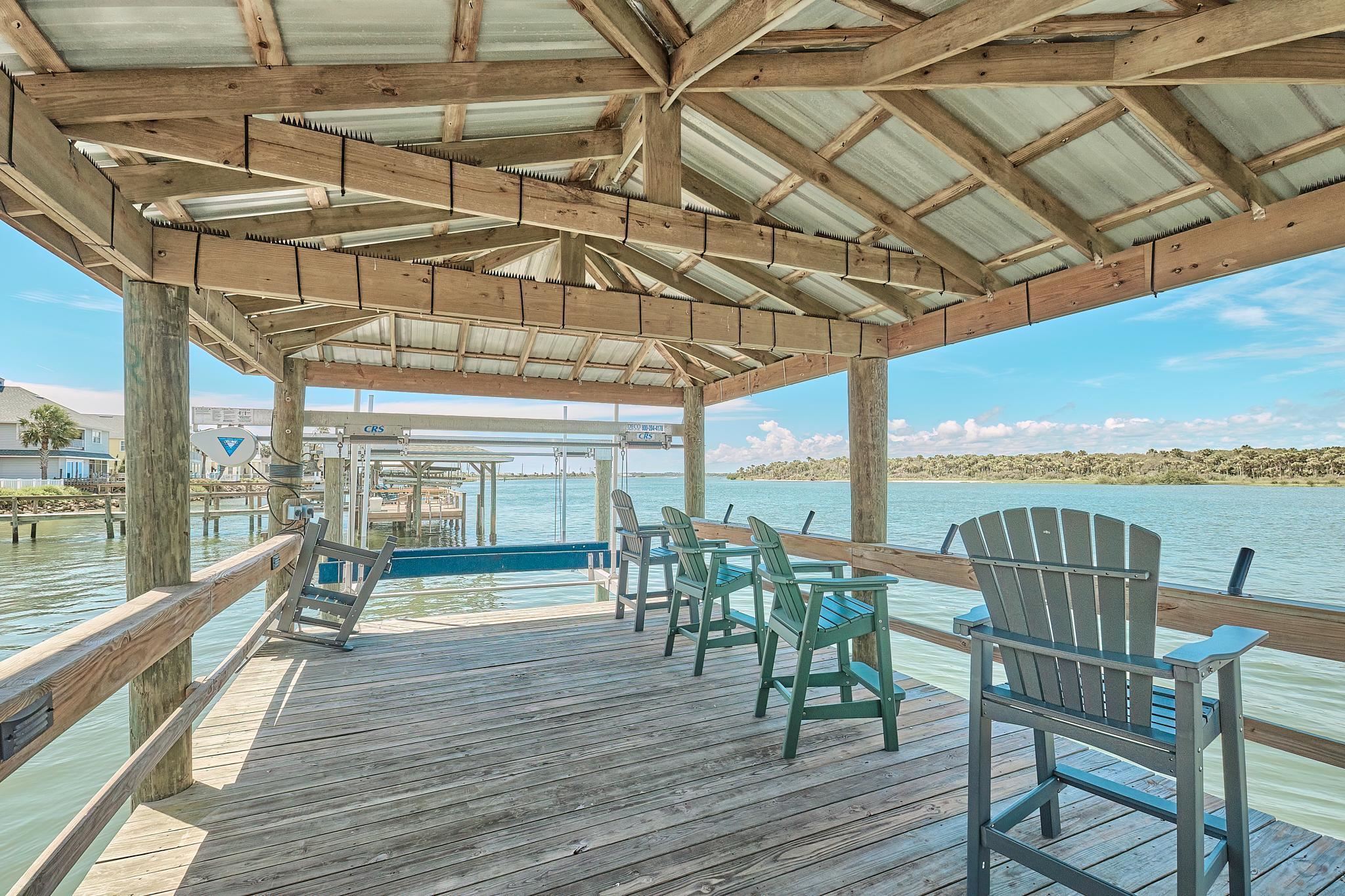 9257 July Lane St. Augustine, FL 32080 - Photo 40 of 48 a view of a chair and table in the balcony