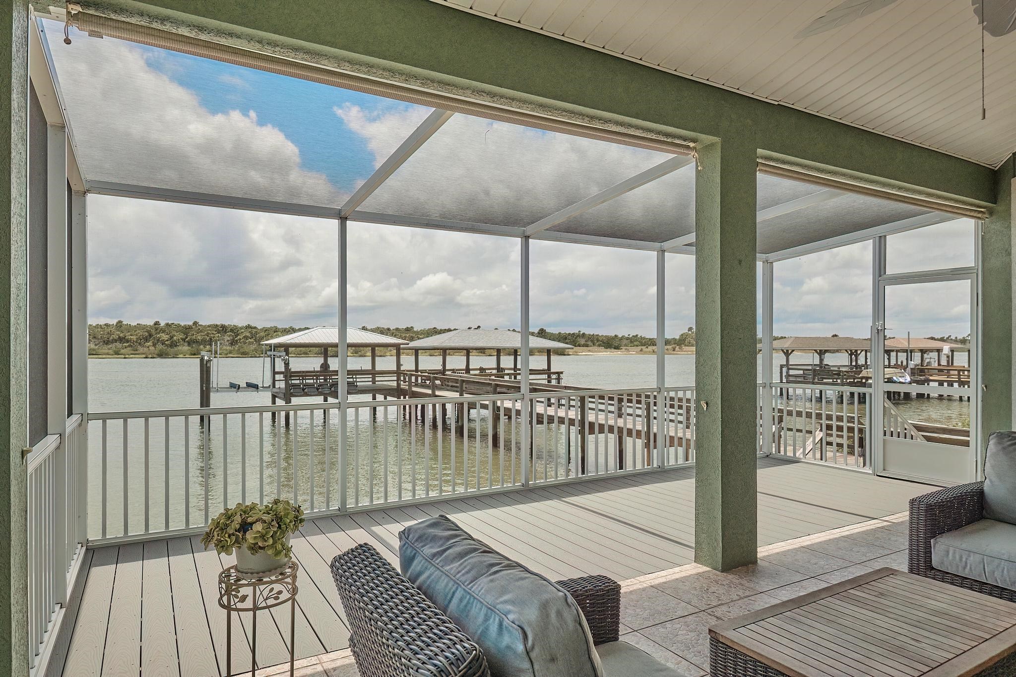 9257 July Lane St. Augustine, FL 32080 - Photo 42 of 48 a balcony with furniture and wooden floor