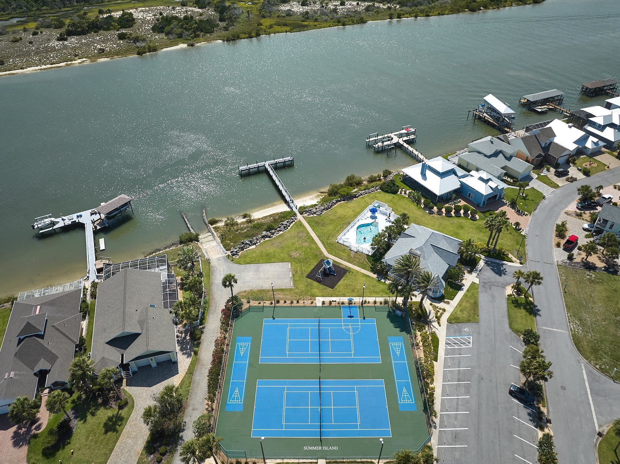 9257 July Lane St. Augustine, FL 32080 - Photo 44 of 48 an aerial view of a house with a pool yard and outdoor seating