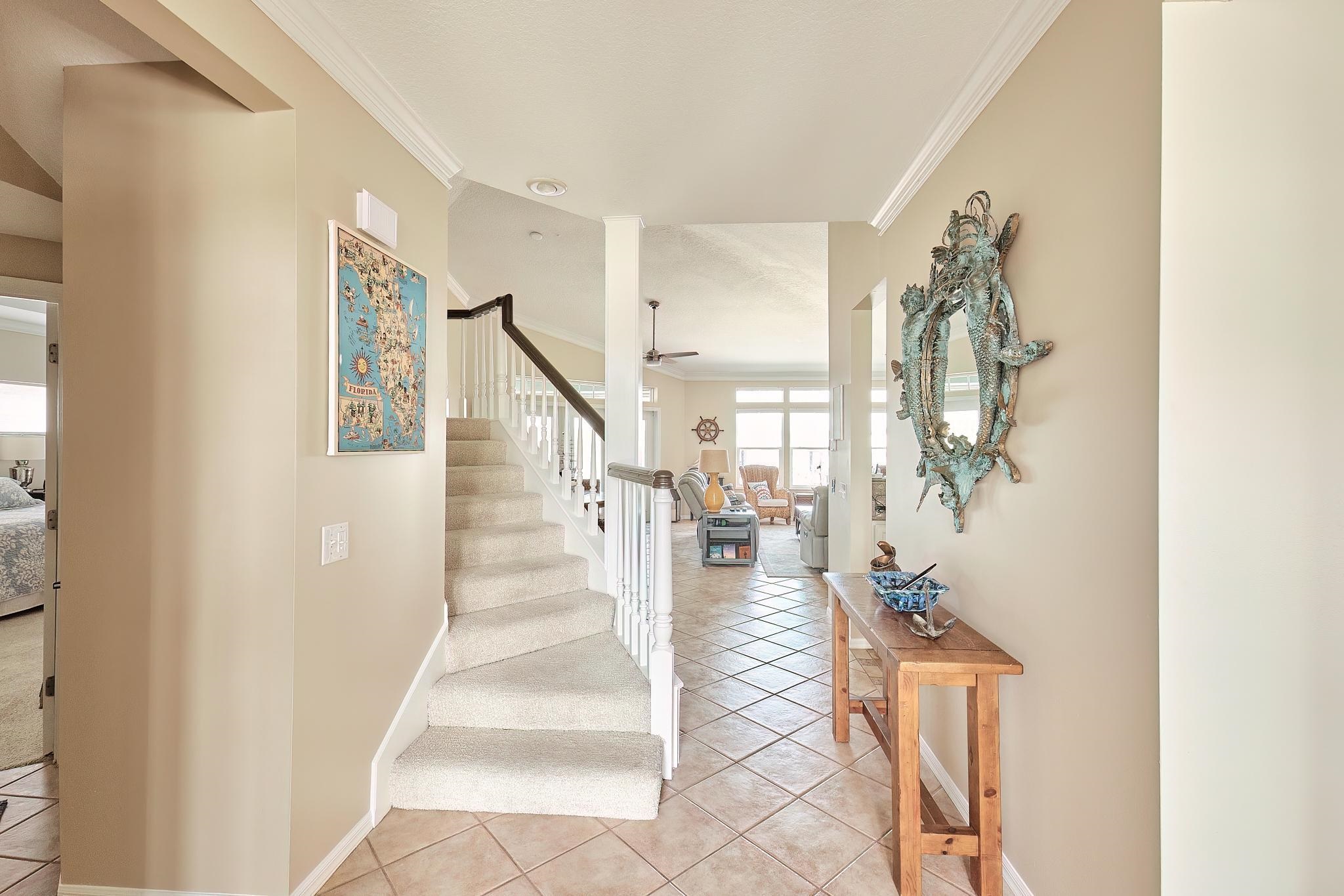 9257 July Lane St. Augustine, FL 32080 - Photo 7 of 48 a view of entryway and hall with wooden floor