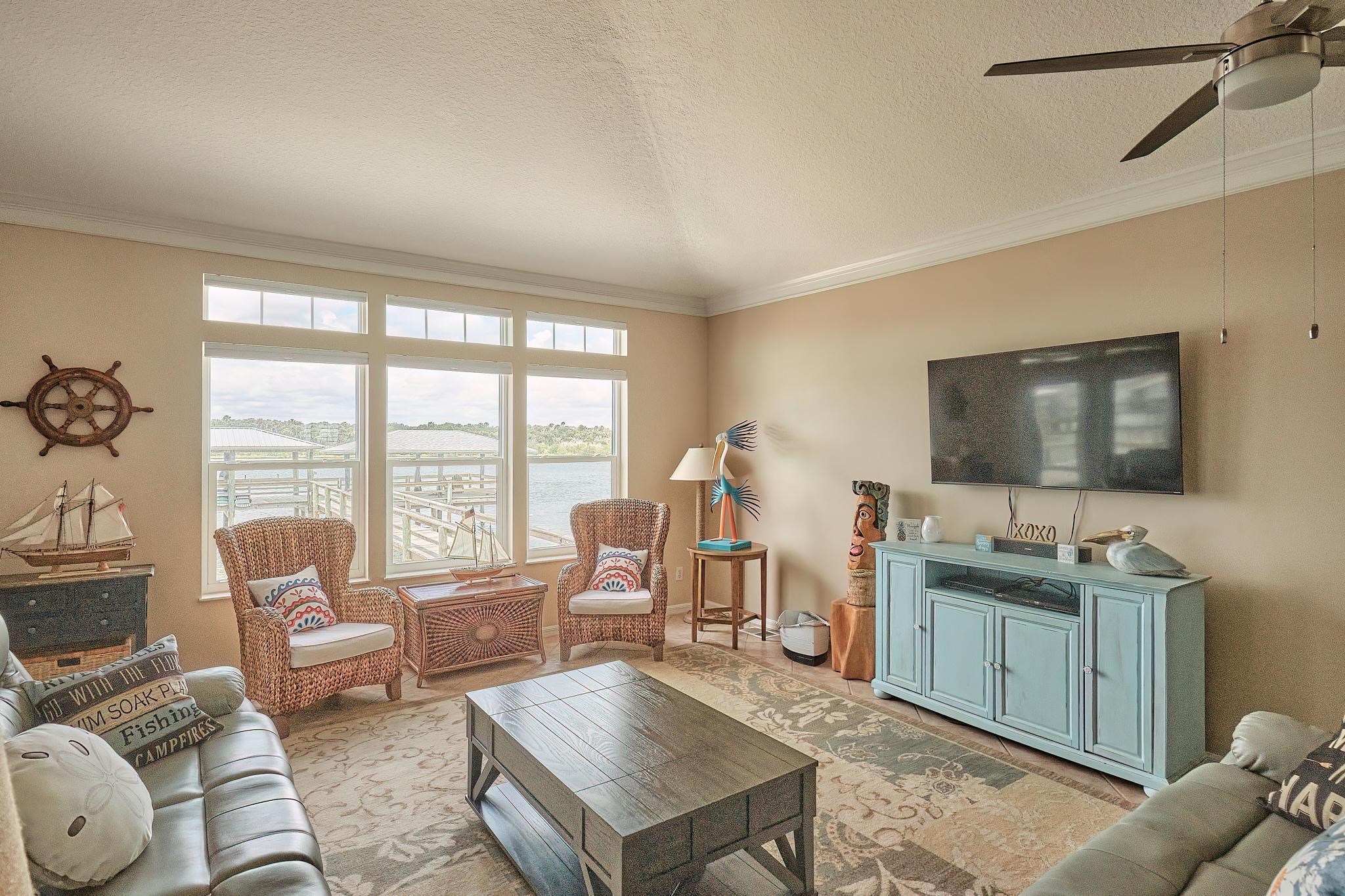 9257 July Lane St. Augustine, FL 32080 - Photo 9 of 48 a living room with furniture and a flat screen tv