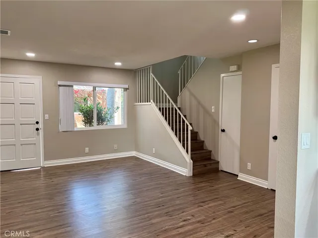 a view of entryway with wooden floor