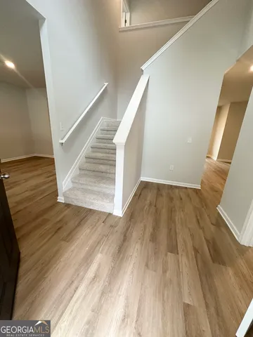 a view of entryway with wooden floor