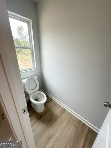 a view of a bathroom with a toilet