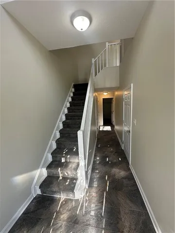 a bathroom with a sink toilet and a mirror