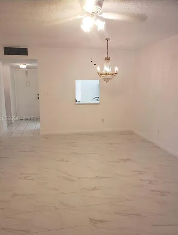 a view of a lake with houses in the back