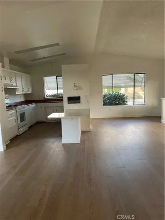 a kitchen with sink and cabinets