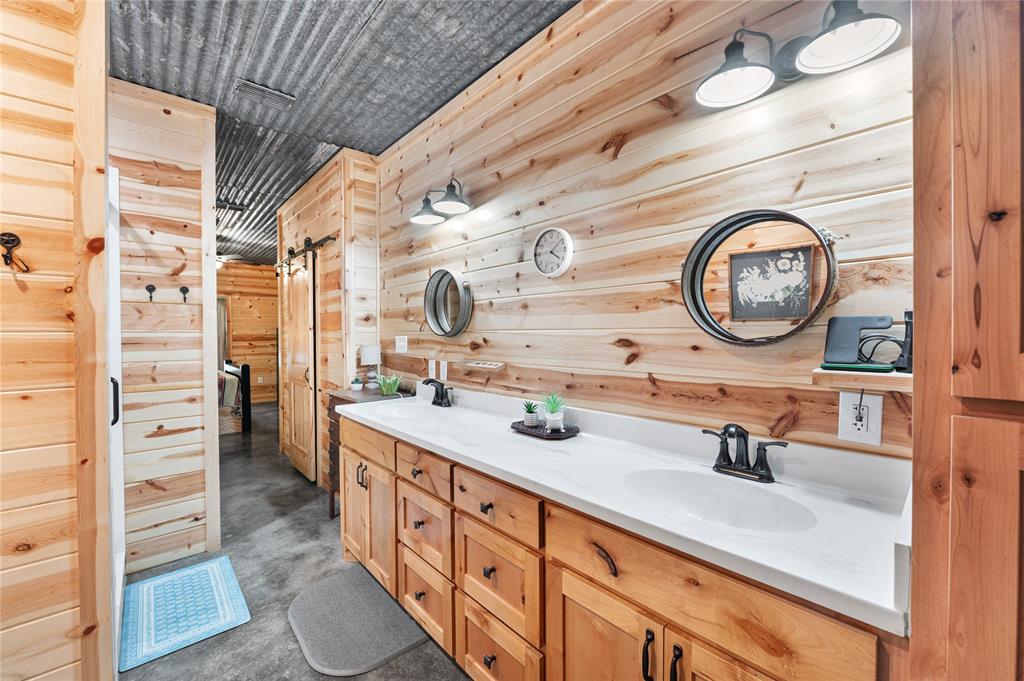 3815 Fm 2088 Quitman, TX 75783 - Photo 12 of 24 a bathroom with a double vanity sink and a mirror