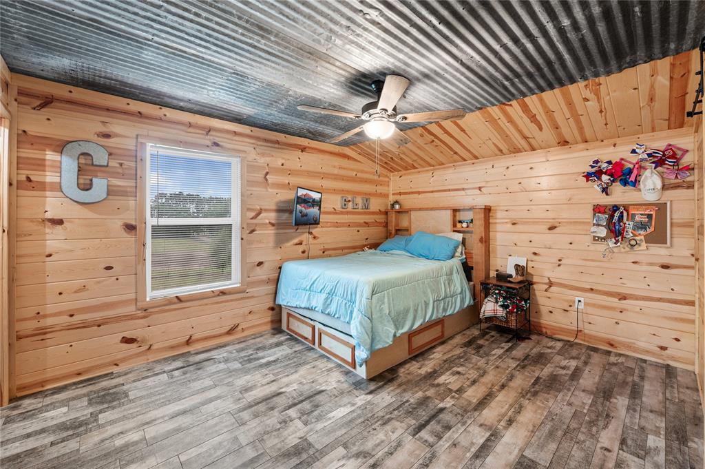 3815 Fm 2088 Quitman, TX 75783 - Photo 13 of 24 a bedroom with a bed and wooden floor