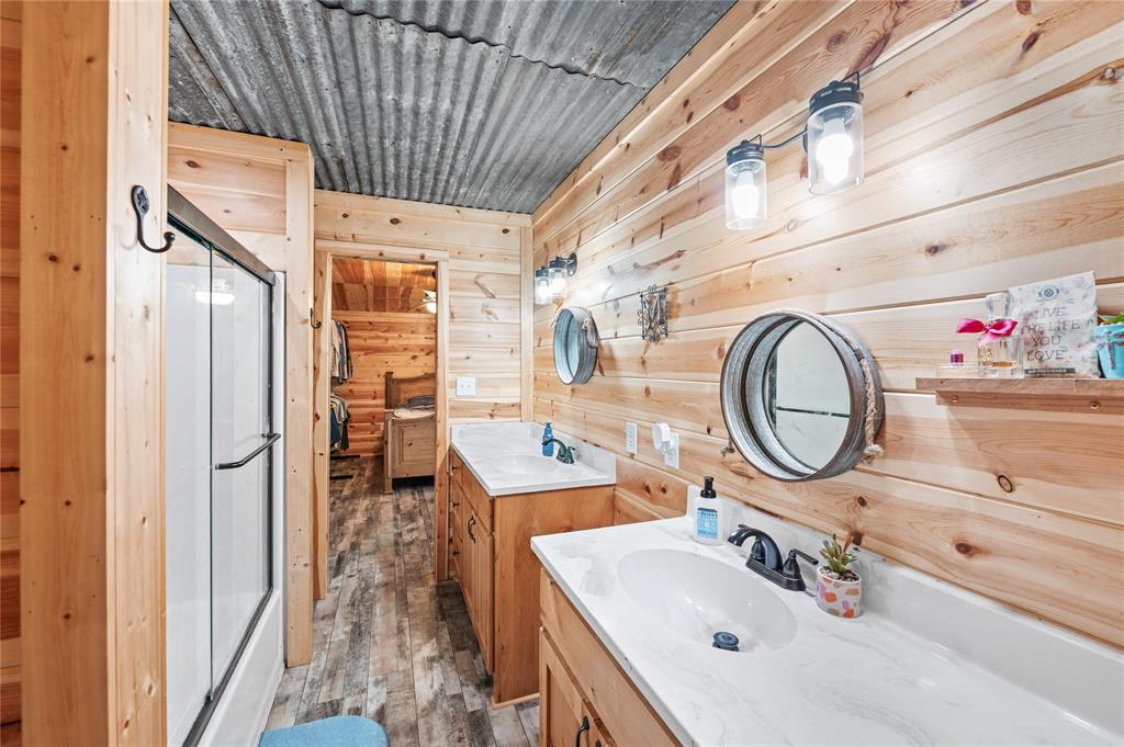 3815 Fm 2088 Quitman, TX 75783 - Photo 14 of 24 a bathroom with a sink a mirror and shower