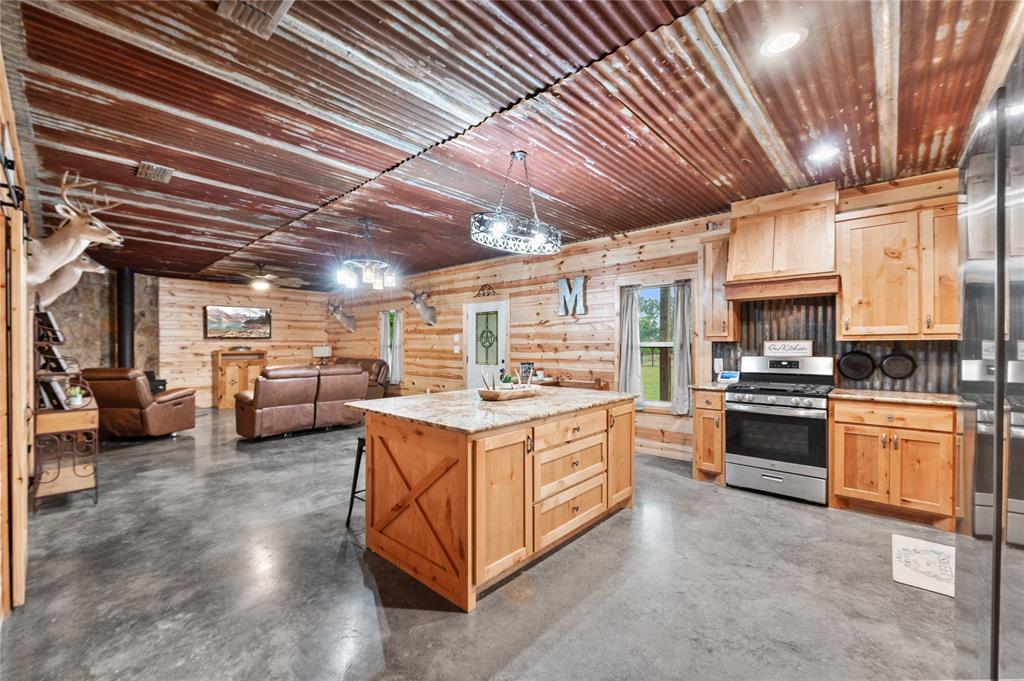 3815 Fm 2088 Quitman, TX 75783 - Photo 5 of 24 a kitchen with stove and cabinets