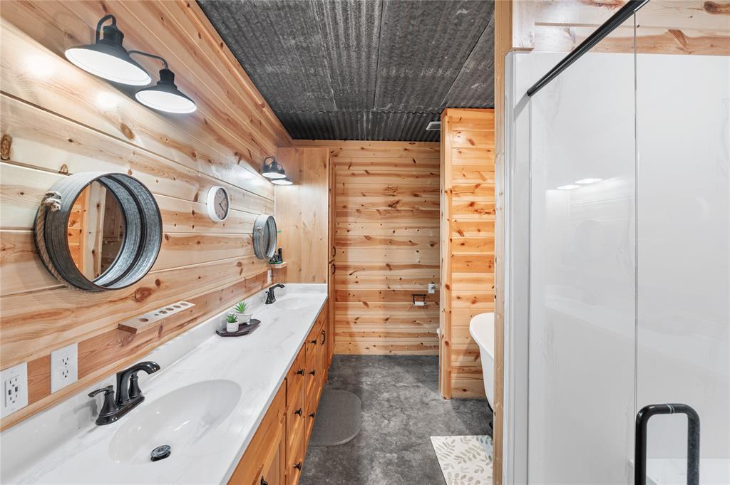 3815 Fm 2088 Quitman, TX 75783 - Photo 10 of 24 a bathroom with a sink a mirror and shower