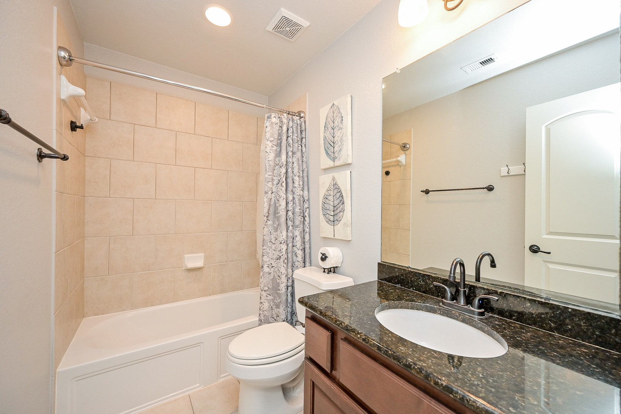 11 South Victoriana Circle Spring, TX 77389 - Photo 33 of 38 a bathroom with a granite countertop sink toilet mirror and shower