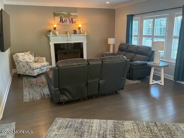 a kitchen with stainless steel appliances granite countertop a sink a microwave cabinets and a dining table