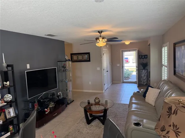 a view of a balcony with lake view and a floor to ceiling window