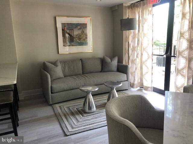 1600 Hagys Ford Road, Unit 5M Penn Valley, PA 19072 - Photo 13 of 18 a living room with furniture and a large window