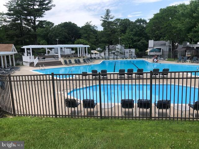 1600 Hagys Ford Road, Unit 5M Penn Valley, PA 19072 - Photo 16 of 18 a view of a house with backyard and deck