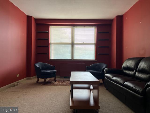 1600 Hagys Ford Road, Unit 5M Penn Valley, PA 19072 - Photo 5 of 18 a living room with furniture and a window