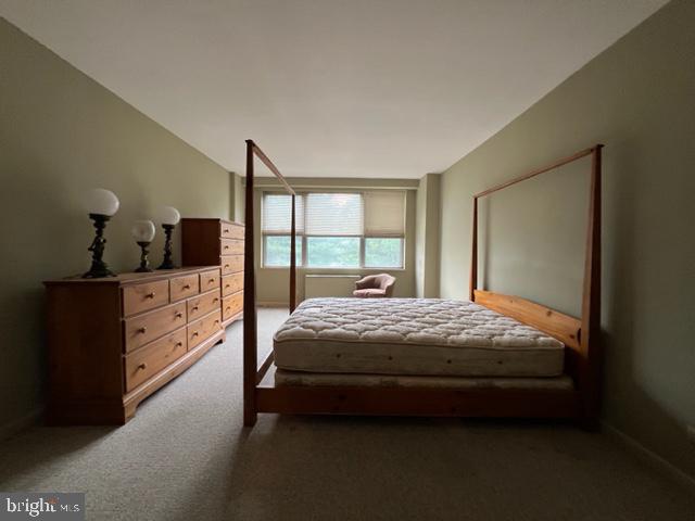 1600 Hagys Ford Road, Unit 5M Penn Valley, PA 19072 - Photo 6 of 18 a bed sitting in a bedroom next to a window