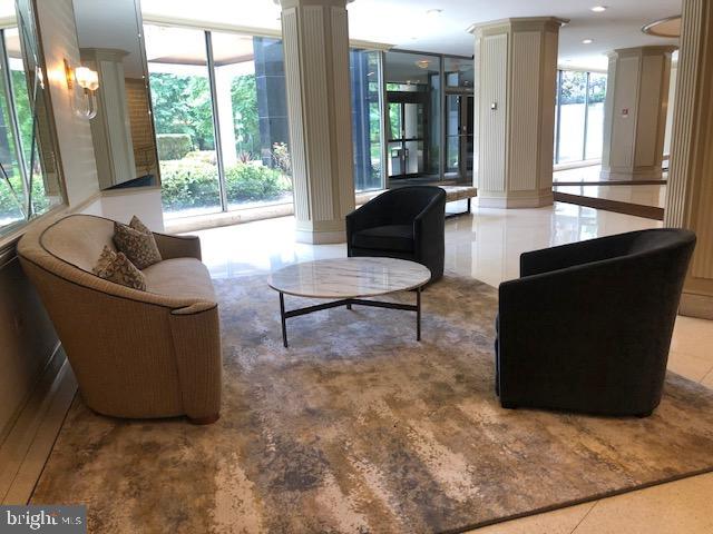 1600 Hagys Ford Road, Unit 5M Penn Valley, PA 19072 - Photo 10 of 18 a living room with furniture and a large window