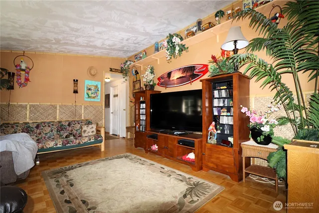 a living room with furniture and a flat screen tv