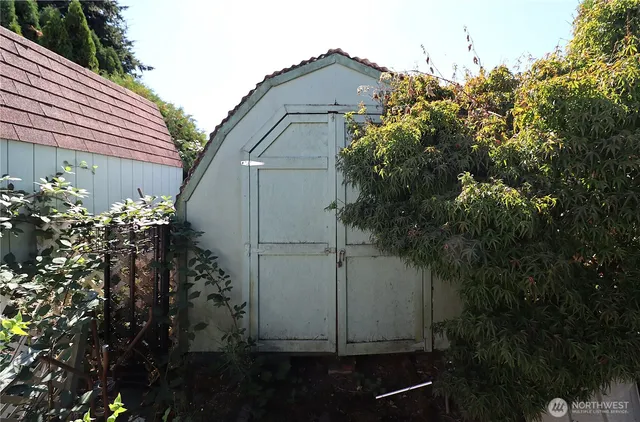 a view of a chairs setting in front of a house
