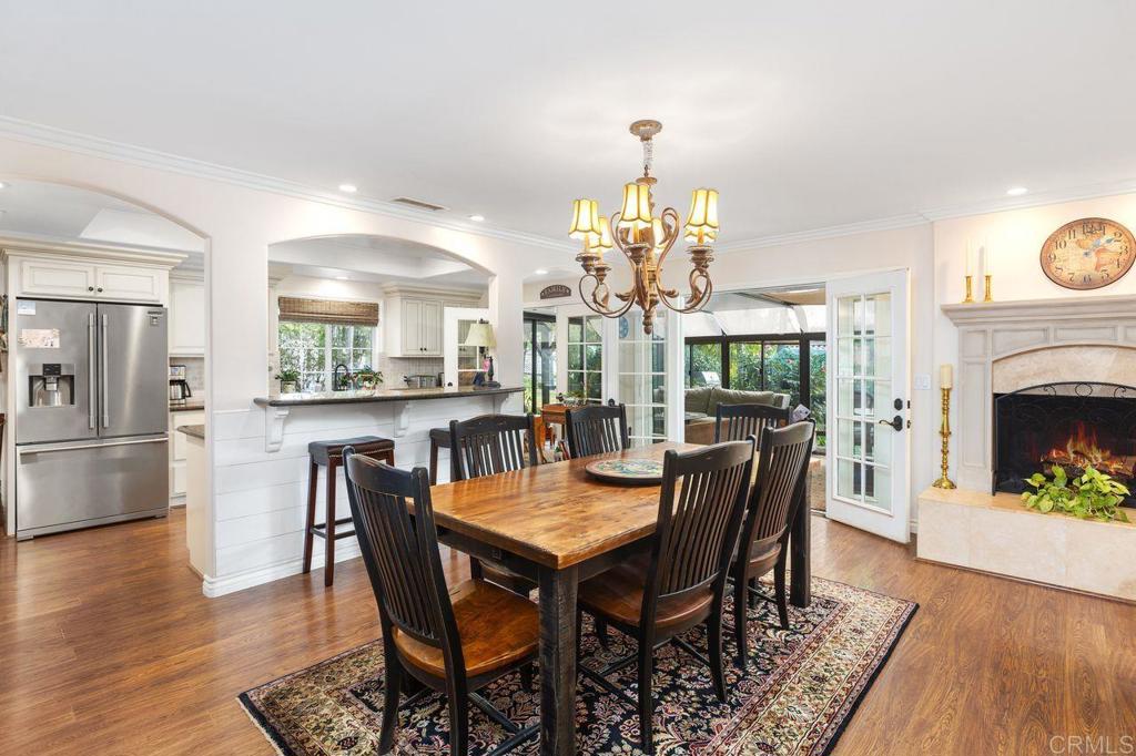 3433 Royal Road Vista, CA 92084 - Photo 13 of 45 a view of a dining room with furniture and wooden floor