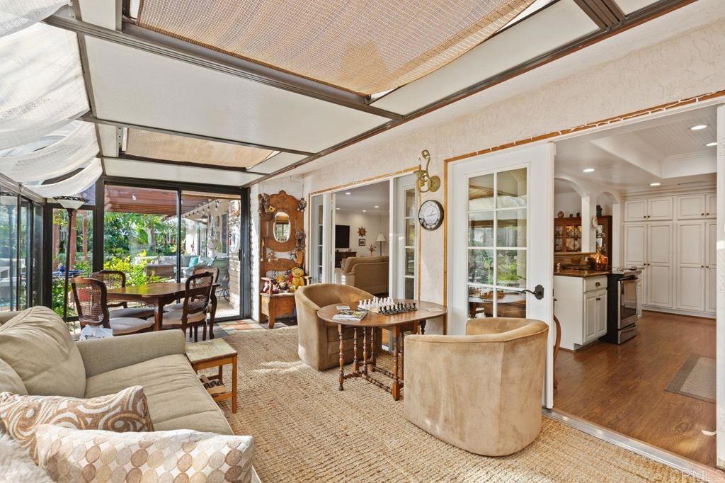 3433 Royal Road Vista, CA 92084 - Photo 18 of 45 a living room with furniture and large windows