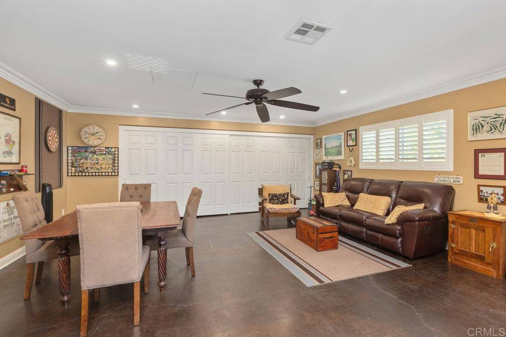 3433 Royal Road Vista, CA 92084 - Photo 29 of 45 a living room with furniture a large window and a table