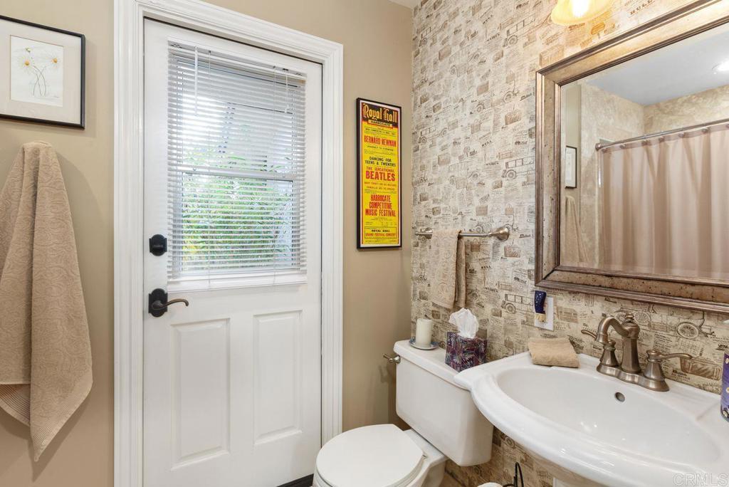 3433 Royal Road Vista, CA 92084 - Photo 30 of 45 a bathroom with a sink a toilet and shower