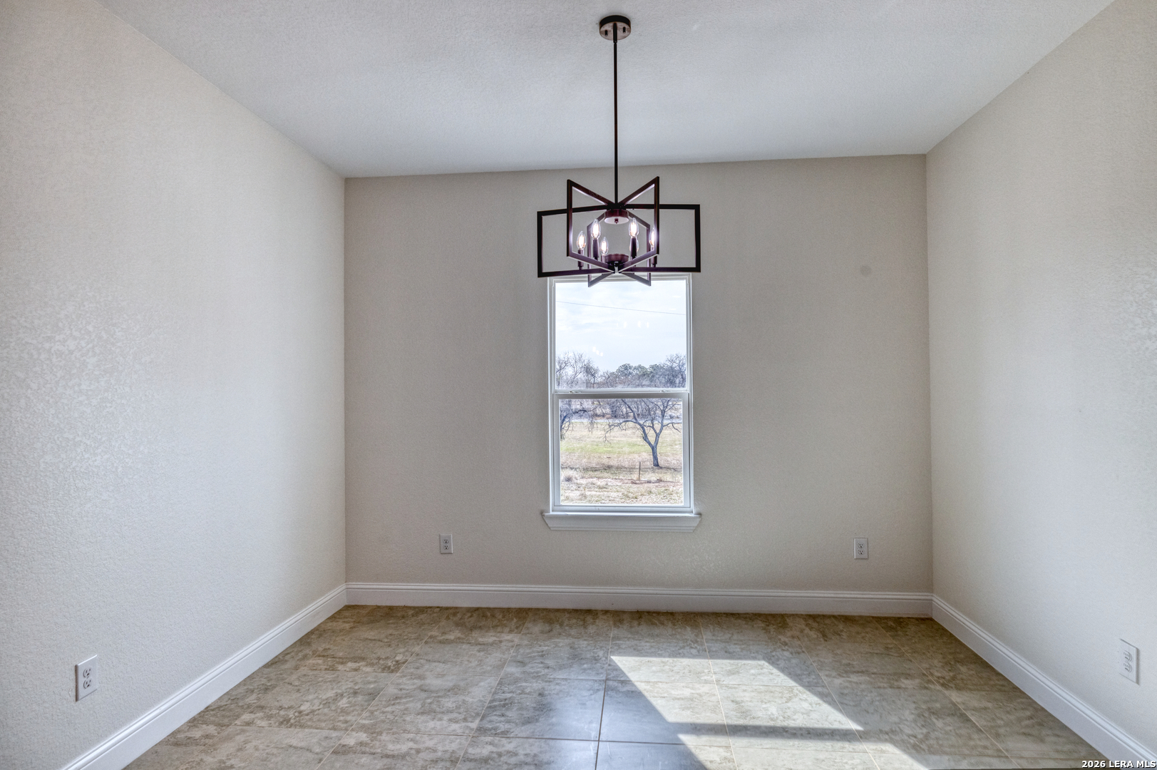 207 Riverside Drive Uvalde, TX 78801 - Photo 11 of 37 a view of an empty room with a window