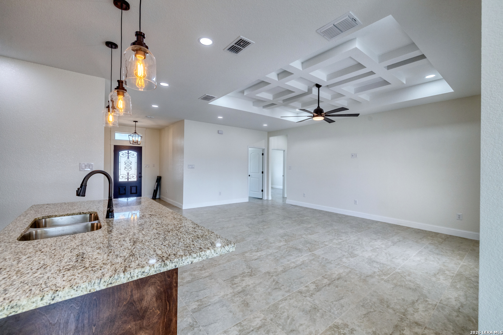207 Riverside Drive Uvalde, TX 78801 - Photo 12 of 37 a kitchen with kitchen island a sink stainless steel appliances and a counter top space