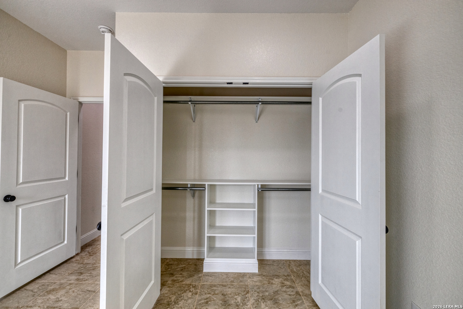 207 Riverside Drive Uvalde, TX 78801 - Photo 18 of 37 a view of walk in closet with empty racks