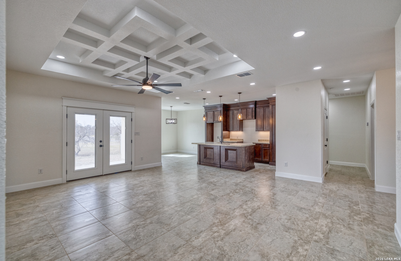 207 Riverside Drive Uvalde, TX 78801 - Photo 20 of 37 a view of a livingroom with a kitchen and a refrigerator