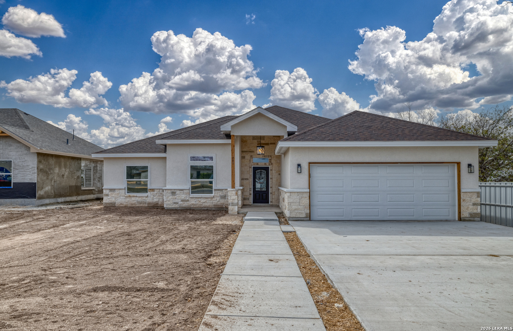 207 Riverside Drive Uvalde, TX 78801 - Photo 2 of 37 a view of a house with a large space and a large window